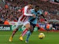 Geoff Cameron of Stoke City competes with Alex Song of West Ham during the Barclays Premier League match on November 1, 2014