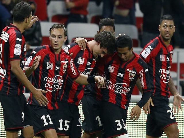 Nice's French defender Gregoire Puel (C) celebrates with teammates after scoring a goal during the French L1 football match against Lyon on November 1, 2014