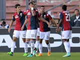 Iago Falque of Genoa CFC is mobbed by team mates after scoring his team's second goal during the Serie A match against Udinese on November 2, 2014