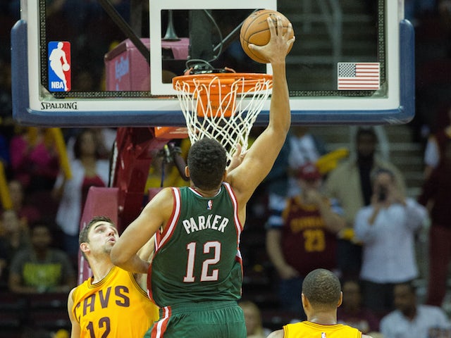 Jabari Parker #12 of the Milwaukee Bucks dunks on the Cleveland Cavaliers during the second half at Quicken Loans Arena on October 14, 2014