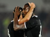 Caen's French defender Jean Calve (L) congratulates Caen's French Guinean forward Bangaly-Fode Koita (R) after he scored a goal during the French first division L1 football match against Metz on November 1, 2014