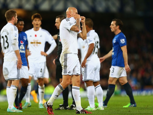 Jonjo Shelvey of Swansea City reacts after being sent off for a second yellow card during the Barclays Premier League match against Everton on November 1, 2014