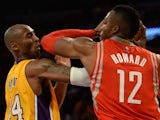 Kobe Bryant (L) of the Los Angeles Lakers and Dwight Howard (R) of the Houston Rockets clash during the Laker's first regular season NBA game, October 28, 2014
