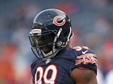Lamarr Houston #99 of the Chicago Bears participates in warm-ups before a preseason game against the Philadelphia Eagles at Soldier Field on August 8, 2014