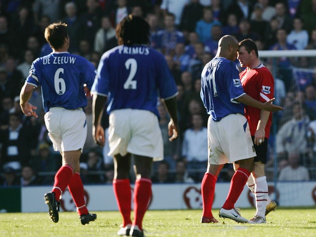 Wayne Rooney of Manchester squares up to Nigel Quashie of Portsmouth during the Barclays Premiership match between Portsmouth and Manchester United at Fratton Park, on October 30, 2004