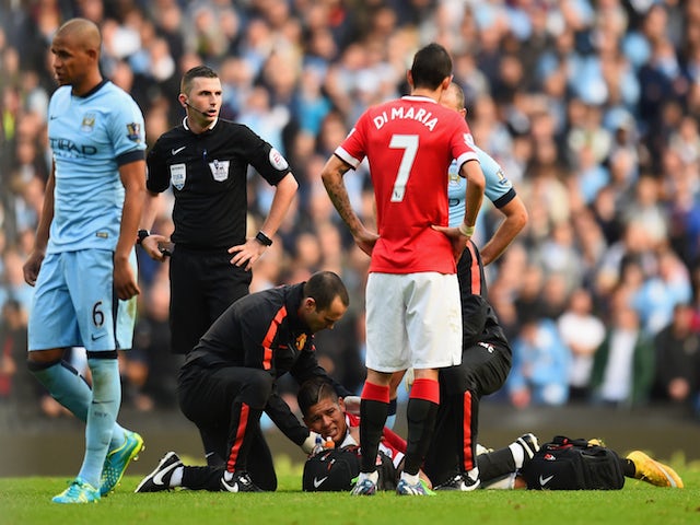 Marcos Rojo of Manchester United receives treatment during the Barclays Premier League match against Manchester City on November 2, 2014
