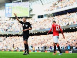Chris Smalling of Manchester United leaves the field after receiving a red card from referee Michael Oliver during the Barclays Premier League match against Manchester City on November 2, 2014