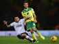 Gary O'Neil of Norwich City tackles Mark Davies of Bolton during the Sky Bet Championship match between Norwich City and Bolton Wanderers at Carrow Road on October 31, 2014