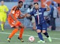 Lorient's French midfielder Raffidine Abdullah (L) vies with Paris Saint-Germain's Argentinian midfielder Ezequiel Lavezzi during the French first division L1 football match on November 1, 2014