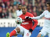 Romulo of FC Spartak Moscow challenged by Aleksandr Sheshukov of FC Lokomotiv Moscow during the Russian Premier League match between FC Spartak Moscow and FC Lokomotiv Moscow at the Arena Otkritie Stadium on October 26, 2014
