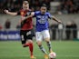 Guingamp's Danish forward Ronnie Schwartz (L) vies for the ball with Bastia's French Algerian midfielder Ryad Boudebouz (R) during the French L1 football match on November 1, 2014