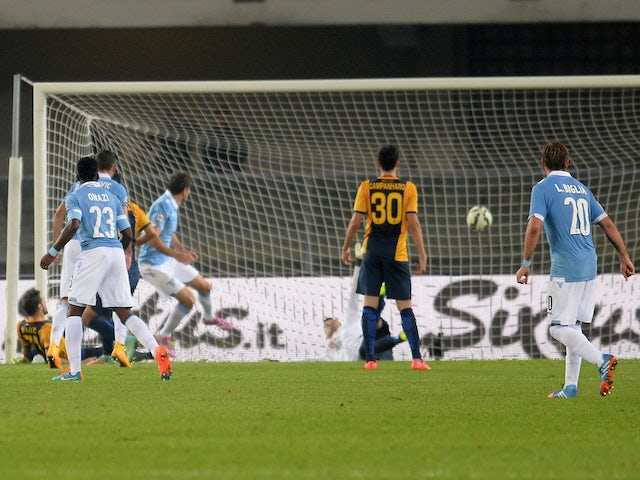 Senad Lulic (C) of Lazio scores his opening goal during the Serie A match between Hellas Verona FC and SS Lazio at Stadio Marc'Antonio Bentegodi on October 30, 2014