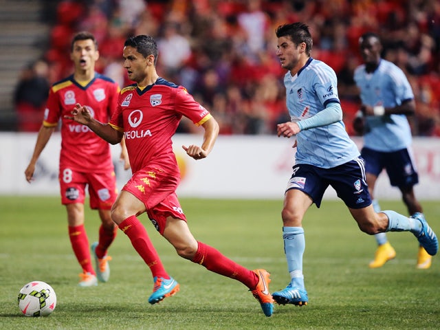 Marcelo Carrusca of Adelaide United runs with the ball during the round five A-League match between Adelaide United and Sydney FC at Coopers Stadium on November 7, 2014