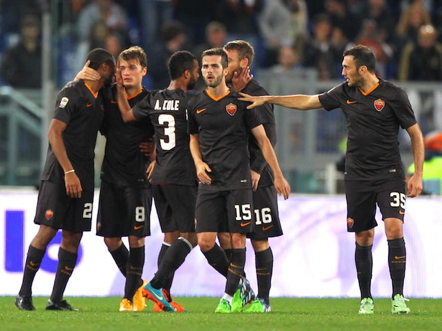 Adem Ljaijc (2nd-L) of AS Roma with his teammates celebrates after scoring the third team's goal during the Serie A match between AS Roma and Torino on November 9, 2014