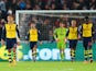 Alexis Sanchez of Arsenal (L) and team mates look dejected as they concede a goal during the Barclays Premier League match against Swansea on November 9, 2014