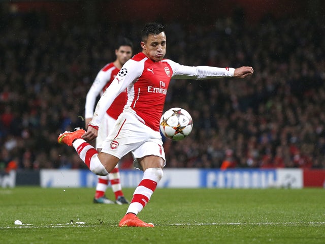 Arsenal's Chilean striker Alexis Sanchez scores his team's second goal during the UEFA Champions League Group D football match between Arsenal and Anderlecht at the Emirates Stadium in north London on November 4, 2014