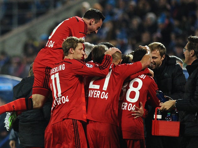 Bayer Leverkusen's football players celebrate a goal during their UEFA Champions League Group C football match between Bayer Leverkusen and Zenit at Petrovsky Stadium in St. Petersburg, Russia, on St. Petersburg on November 4, 2014