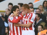 Bojan Krkic (L) of Stoke City celebrates with teammate Steve Sidwell of Stoke City after scoring the opening goal during the Barclays Premier League match against Spurs on November 9, 2014