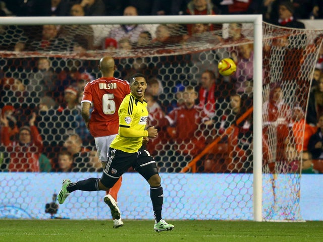 Andre Gray of Brentford celebrates scoring their second goal during the Sky Bet Championship match between Nottingham Forest and Brentford at the City Ground on November 5, 2014