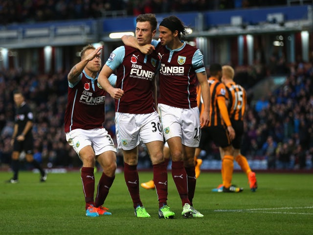 Ashley Barnes of Burnley celebrates scoring the opening goal with team mates during the Barclays Premier League match between Burnley and Hull City at Turf Moor on November 8, 2014