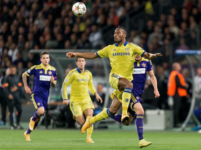 Chelsea's Didier Drogba vies for the ball with Aleksander Rajcevic of NK Maribor during the UEFA Champions League Group G football match between NK Maribor and Chelsea in Maribor, Slovenia on November 5, 2014