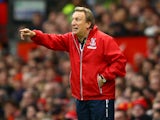 Crystal Palace Manager Neil Warnock gestures during the Barclays Premier League match between Manchester United and Crystal Palace at Old Trafford on November 8, 2014