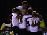 Jordon Ibe of Derby County is mobbed after scoring the first goal during the Sky Bet Championship match between Derby County and Huddersfield Town at iPro Stadium on November 4, 2014
