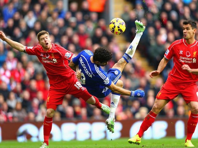 Diego Costa of Chelsea attempts an overhead kick under pressure from Alberto Moreno of Liverpool during the Barclays Premier League match on November 8, 2014