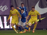 Dynamo Moscow's Mathieu Valbuena fights for the ball with Estoril's Emidio Rafael (L) and Diogo Amado (R) during the UEFA Europa League group E football match Dynamo Moscow vs Estoril in Khimki outside Moscow on November 6, 2013
