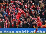 Emre Can of Liverpool celebrates scoring the opening goal during the Barclays Premier League match between Liverpool and Chelsea at Anfield on November 8, 2014