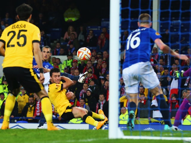 Leon Osman of Everton (obscured 2L) scores their first goal during the UEFA Europa League Group H match between Everton FC and LOSC Lille at Goodison Park on November 6, 2014