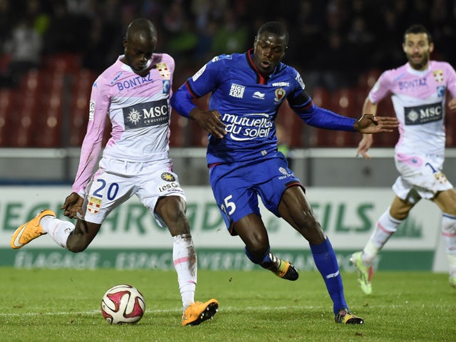 Evian's Senegalese forward Modou Sougou vies with Nice's French defender Romain Genevois during the French L1 football match Evian Thonon Gaillard FC against OGC Nice on November 8