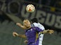PAOK's defender Nikos Spyropoulos and Fiorentina's midfielder from Slovenia Jasmin Kurtic jump for the ball during theUEFA Europa League football match Fiorentina versus Paok, on November 6, 2014