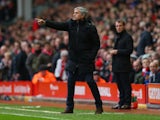 Jose Mourinho manager of Chelsea gives instruction during the Barclays Premier League match between Liverpool and Chelsea at Anfield on November 8, 2014 