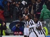 Juventus midfielder Andrea Pirlo celebrates after scoring a goal with Juventus french midfielder Paul Labile Pogba and Juventus midfielder of Ghana Kwadwo Asamoah during the UEFA Champions League Group A football match Juventus vs Olympiakos at the Juvent