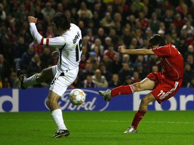 Ibrahim Uzulmez of Besiktas is unable to stop Yossi Benayoun of Liverpool scoring his team's second goal during the UEFA Champions League Group A match between Liverpool and Besiktas at Anfield on November 6, 2007