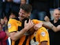 Kwesi Appiah of Cambridge celebrates with team mate and captain Michael Nelson after scoring his and the teams second goal of the game during the Sky Bet League Two match between Cambridge United and Oxford United at The Abbey Stadium on October 11, 2014