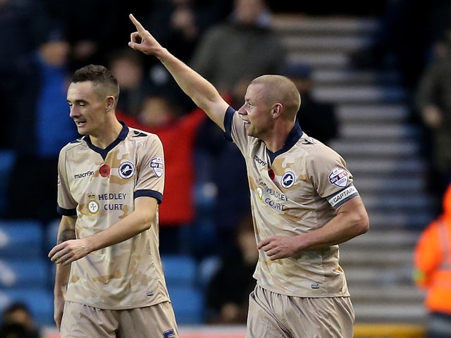 Alan Dunne celebrates after he scores to make it 2-2 during the Sky Bet Championship match between Millwall and Brentford at The Den on November 8, 2014