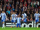 Porto's Colombian forward Jackson Martinez celebrates with his teammates after scoring during the UEFA Champions League football match Athletic Club Bilbao vs FC Porto at the San Mames stadium in Bilbao on November 5, 2014