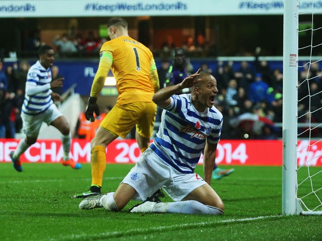 Bobby Zamora of QPR celebrates as Martin Demichelis of Manchester City (not pictured) scores an own goal for QPR's second goal during the Barclays Premier League match between Queens Park Rangers and Manchester City at Loftus Road on November 8, 2014