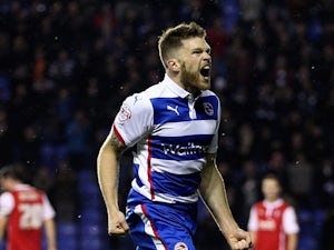 Jamie Mackie of Reading celebrates after scoring the opening goal of the game during the Sky Bet Championship match between Reading and Rotherham United at Madejski Stadium on November 04, 2014