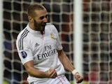 Real Madrid's French forward Karim Benzema celebrates after scoring a goal during the UEFA Champions League group B football match Real Madrid CF vs Liverpool FC at the Santiago Bernabeu stadium in Madrid on November 4, 2014