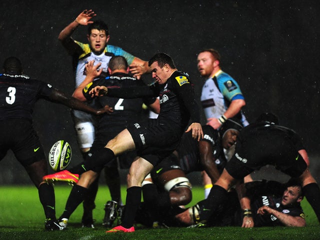 Ben Spencer of Saracens puts in a box kick during the LV= Cup match between Ospreys and Saracens at The Gnoll on November 7, 2014 