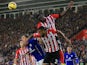 Victor Wanyama of Southampton climbs above Ryan Bertrand of Southampton and Andy King of Leicester City to win the ball during the Barclays Premier League match on November 8, 2014