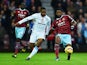 Alexandre Song of West Ham United holds off Charles N'Zogbia of Aston Villa during the Barclays Premier League match between West Ham United and Aston Villa at Boleyn Ground on November 8, 2014