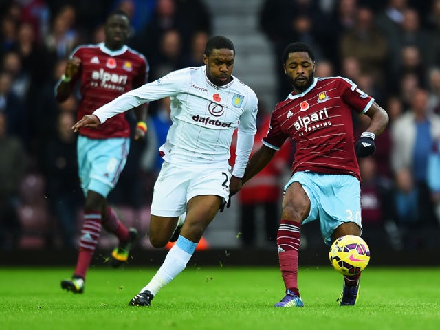 Alexandre Song of West Ham United holds off Charles N'Zogbia of Aston Villa during the Barclays Premier League match between West Ham United and Aston Villa at Boleyn Ground on November 8, 2014