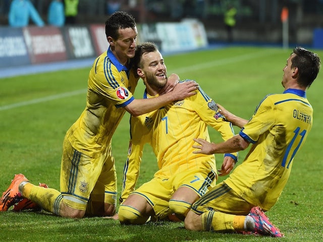Ukraine's Andriy Yarmolenko (C) celebrates after scoring during the Group C Euro 2016 qualifying football match against Luxembourg on November 15, 2014