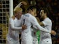 Carl Jenkinson of England celebrates scoring his team's second goal with Will Hughes and Danny Ings during the U21 International Friendly match against Portugal on November 13, 2014