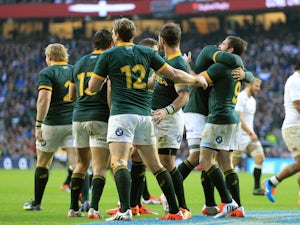 Cobus Reinach of South Africa celebrates after scoring his team's second try of the game during the QBE Intenational match between England and South Africa on November 15, 2014