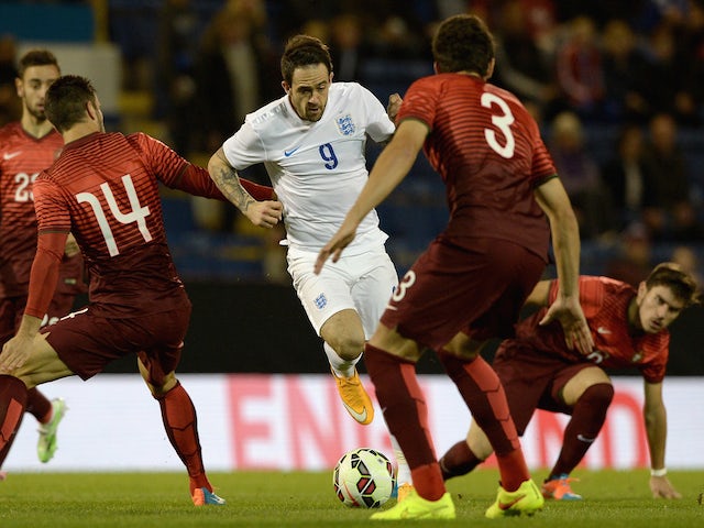 Danny Ings of England takes on the Portugal defence during the U21 International Friendly match between England and Portugal at Turf Moor on November 13, 2014